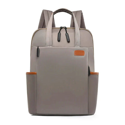Laptop backpack with multiple pockets, adjustable shoulder straps, zipper closure, multi-purpose, school backpack