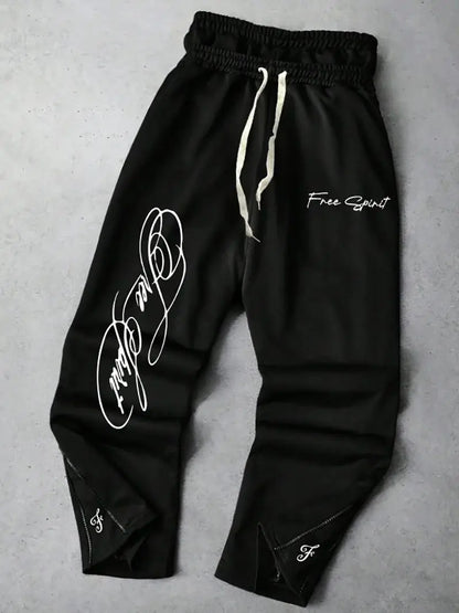 Men's Trendy Street-Style Ins High Street Black Faux Two-Piece Design Sweatpants with Unique Waistband and Ankle Zipper Details. It Is Perfect for Music Festival Outfits or Everyday Wear, Making It a Great Gift for Your Boyfr