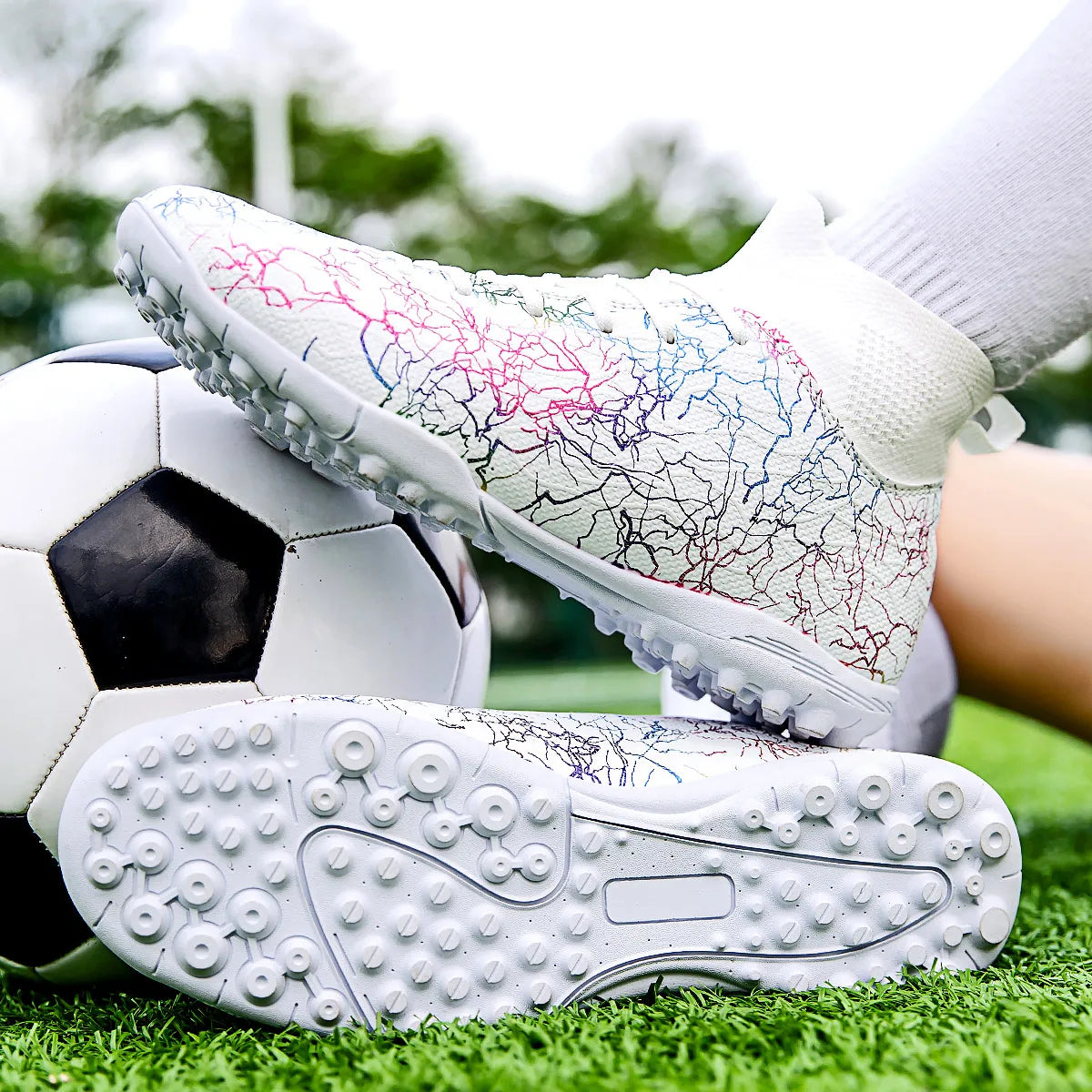 High quality, high-top football shoes, unisex style, comfortable, breathable, available in TF and FG options.  Sole spikes