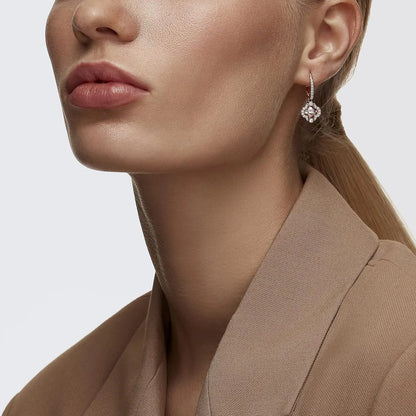 Una Pierced Earrings with Clear Crystal Pavé Surrounding a Pink Stone on a Rose-Gold Tone Finished Setting
