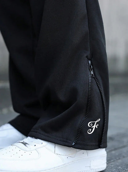 Men's Trendy Street-Style Ins High Street Black Faux Two-Piece Design Sweatpants with Unique Waistband and Ankle Zipper Details. It Is Perfect for Music Festival Outfits or Everyday Wear, Making It a Great Gift for Your Boyfr