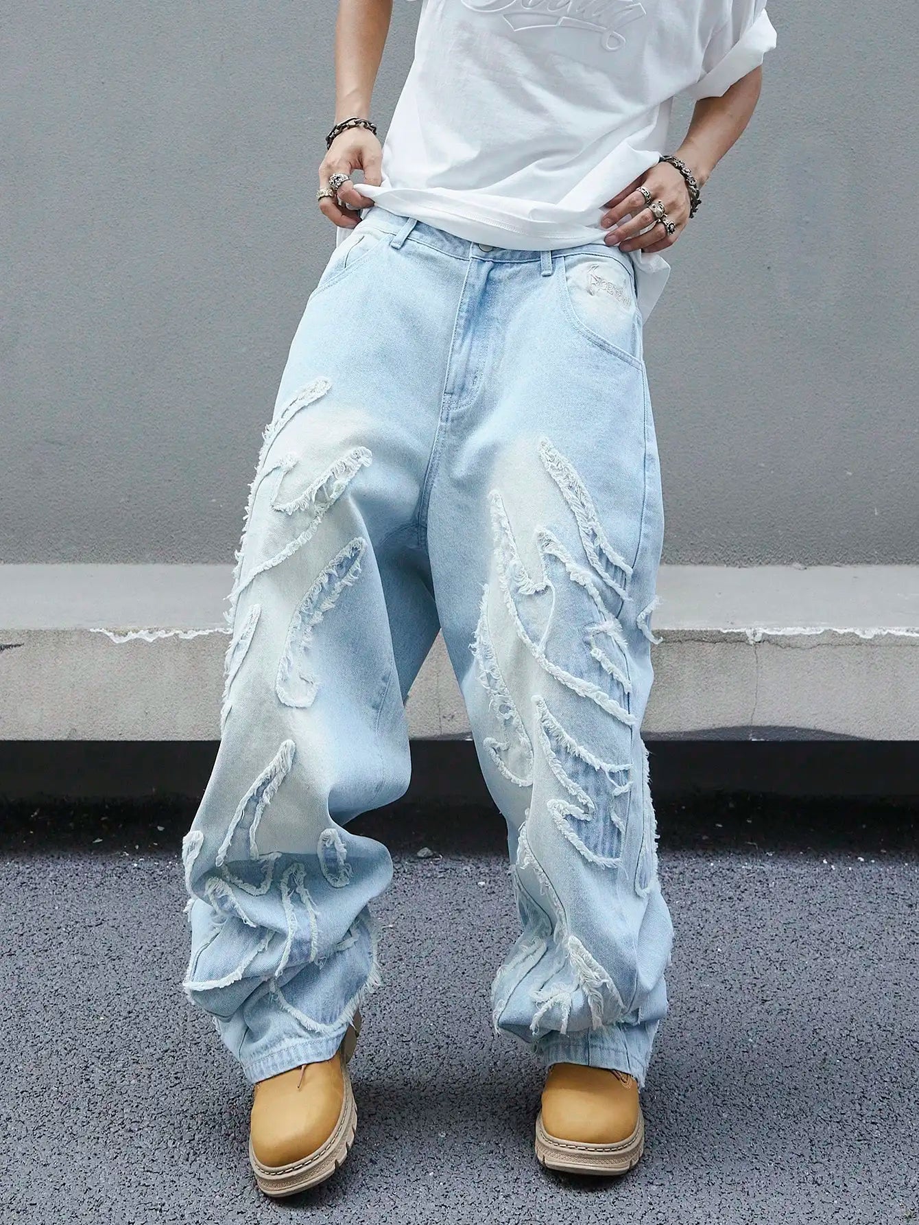 Men's trendy and cool denim wide-leg pants for all seasons featuring unique patchwork patterns, light blue street-stunning style