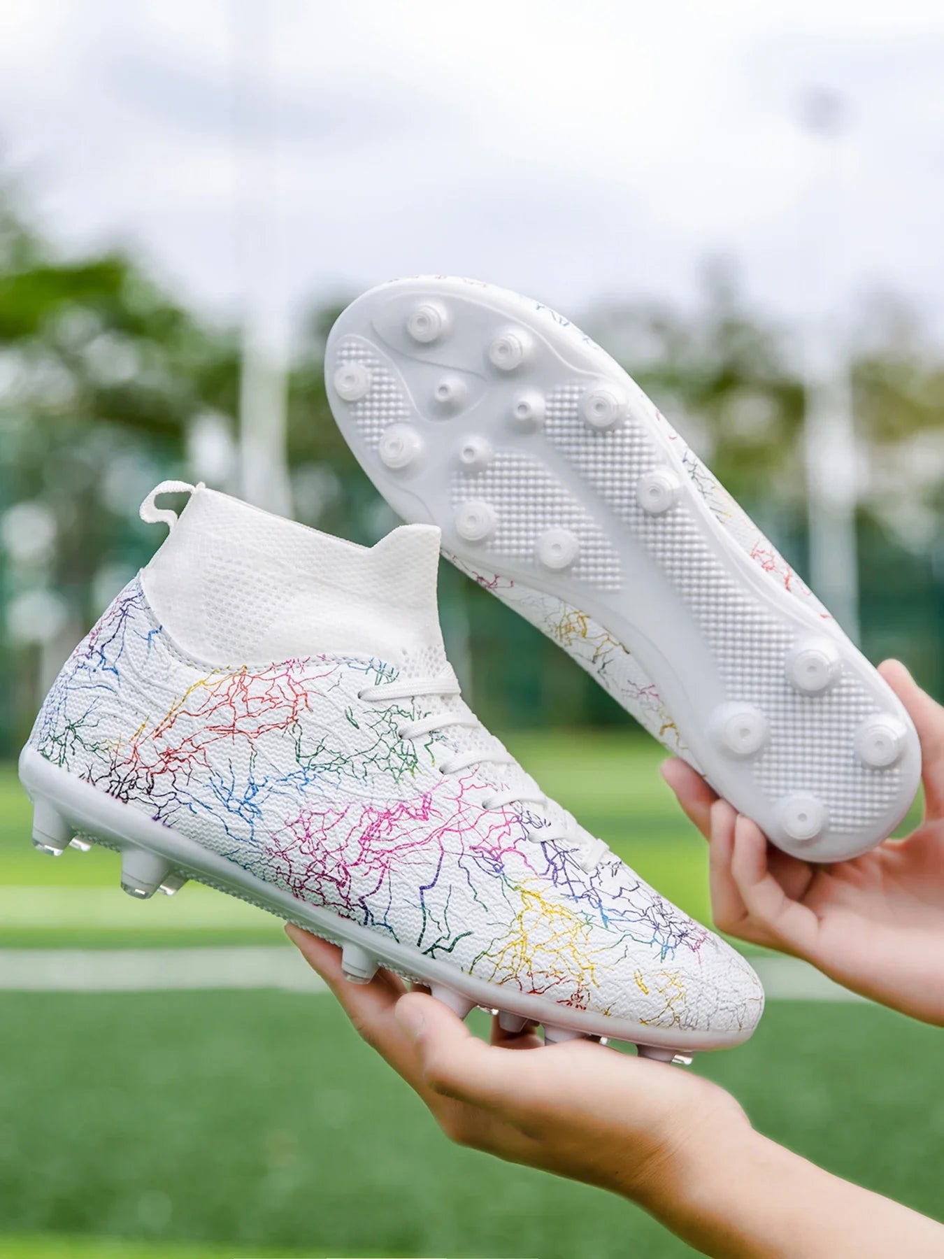 High quality, high-top football shoes, unisex style, comfortable, breathable, available in TF and FG options.  Sole spikes