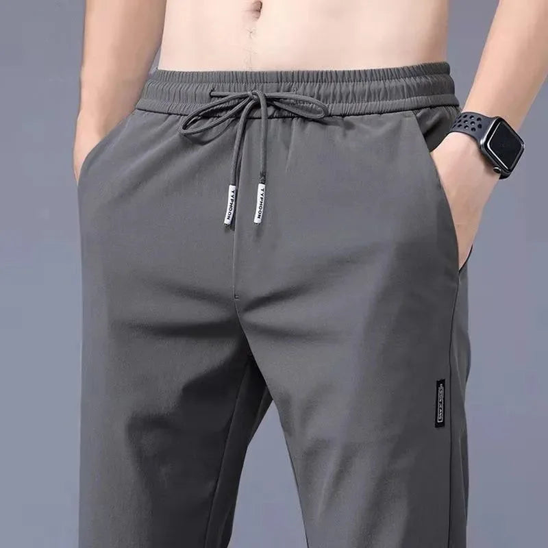 Men's Summer Ice Silk Pants Mesh Breathable Casual Thin Quick Dry Pants Loose Elastic Beam Feet Pants Sports Fitness Trousers