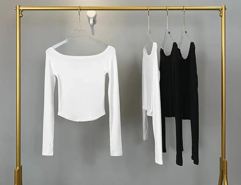 Camiseta Feminina Sexy com Decote Canoa de Algodão Manga Longa Cropped Tee Camiseta Feminina Slim Preta Branca Tops 2026