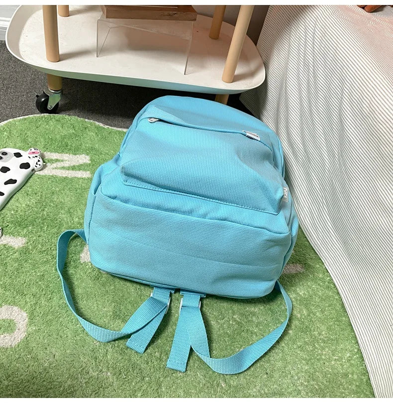 Sweet soft girl solid color large capacity student backpack new style for men and women college students simple trendy