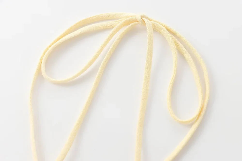 Textured halter crop top with ruffles Women's short yellow sleeveless top with sexy streamers for summer 2025 ETJ