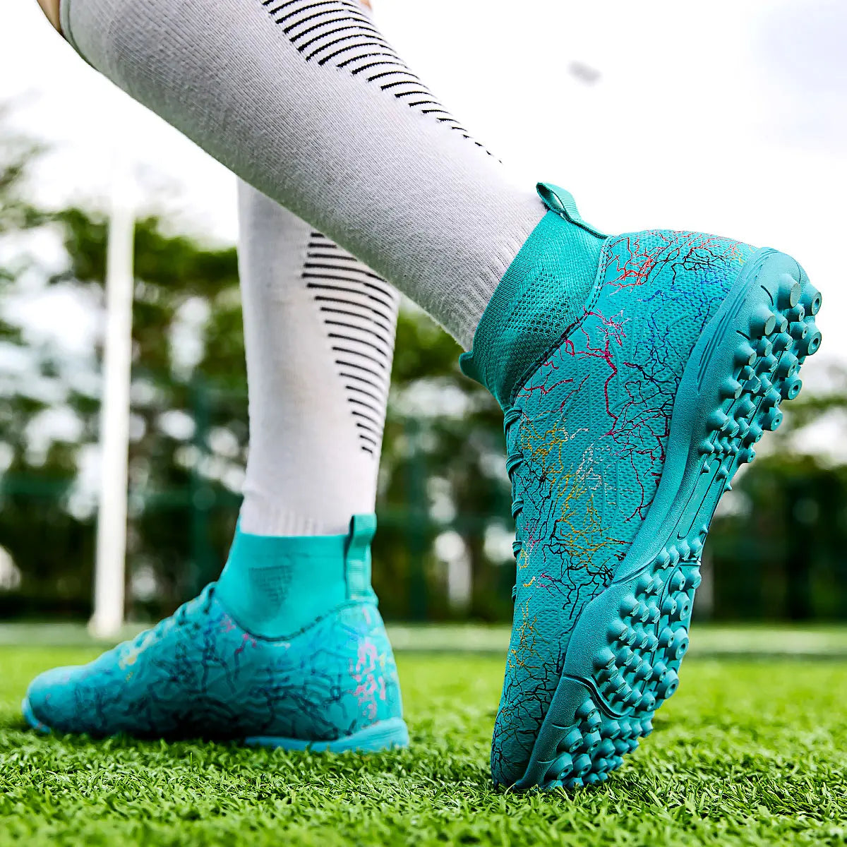 High quality, high-top football shoes, unisex style, comfortable, breathable, available in TF and FG options.  Sole spikes
