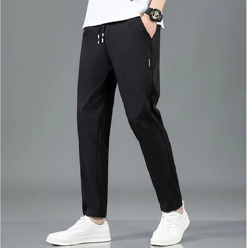 Men's Summer Ice Silk Pants Mesh Breathable Casual Thin Quick Dry Pants Loose Elastic Beam Feet Pants Sports Fitness Trousers