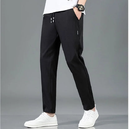 Men's Summer Ice Silk Pants Mesh Breathable Casual Thin Quick Dry Pants Loose Elastic Beam Feet Pants Sports Fitness Trousers