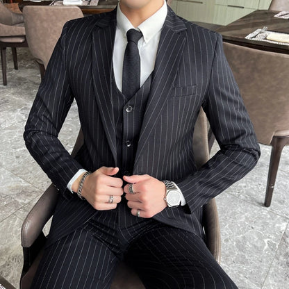 New three-piece suit with tailored striped business suit blazer and trousers set. Korean fashion trend. Stylish wedding attire.