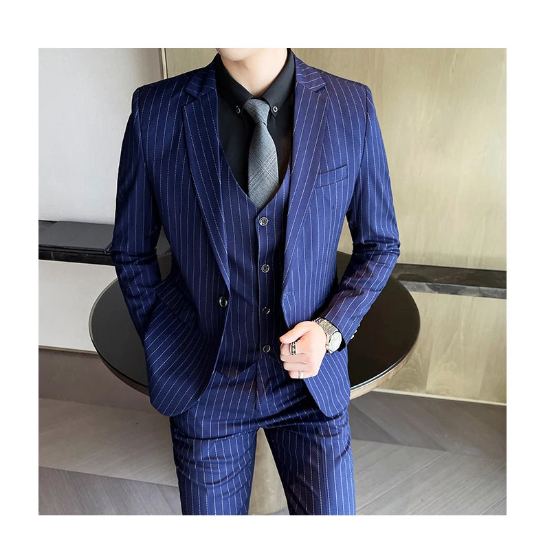 New three-piece suit with tailored striped business suit blazer and trousers set. Korean fashion trend. Stylish wedding attire.